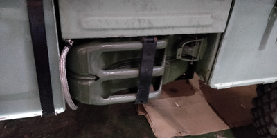 Diesel fuel tank masquerading as a spare jerry can